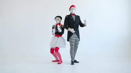 Two Mimes Perform Together on White Background