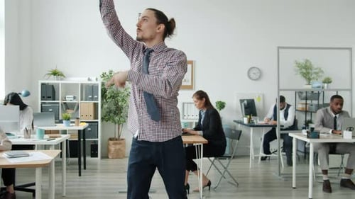 Funny Employee Dancing Fooling Around in Office Then Business Team Joining Him Having Fun Together