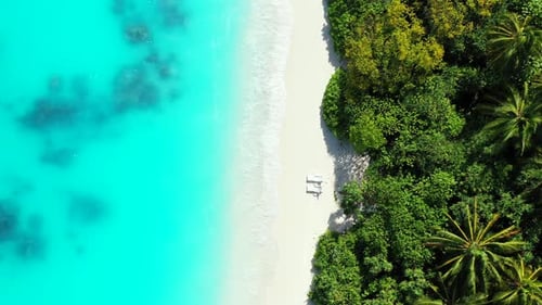 Luxury flying abstract view of a paradise sunny white sand beach and aqua blue water background in c