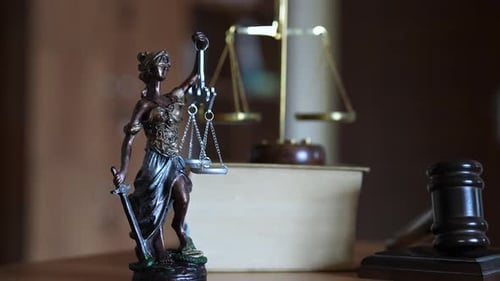 Statue of Lady Justice with Scales and Gavel