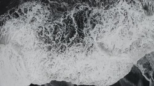 Aerial View of Black Sand Beach in Cloudy Weather. The Beginning of Spring in Iceland
