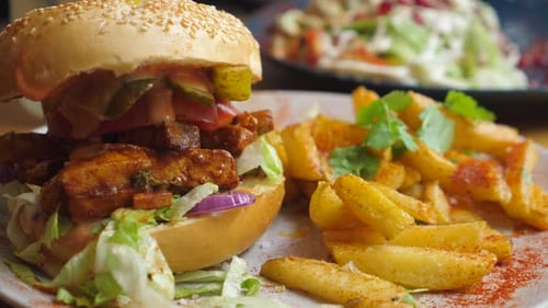 Healthy Organic Vegan Burger Served with French Fries. Plant Based Junk Food Alternative.