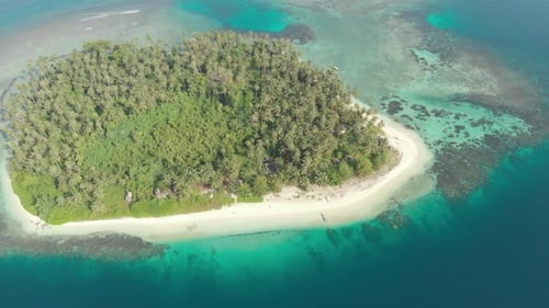 Aerial: flying over coral reef tropical caribbean sea, turquoise blue water