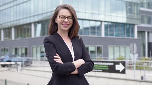 Confident Business Woman Standing Near Modern Building