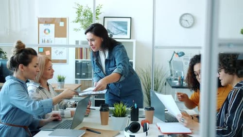 Women Collaborating in Modern Office Meeting