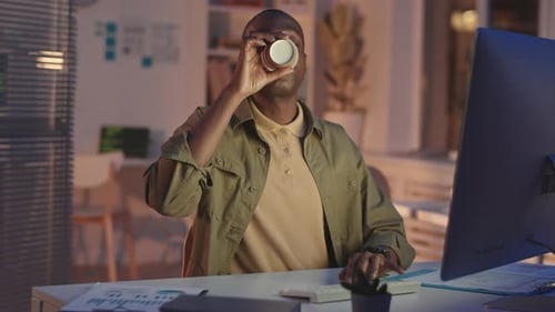 African-American Programmer Working Late at Night