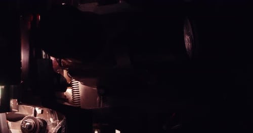 Vintage Film Projector Operating in the Dark