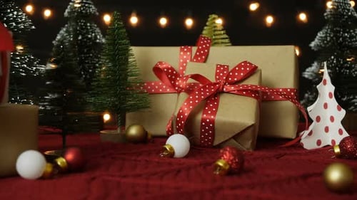 Festive Christmas Gift Boxes on Red Blanket