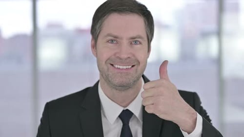 Close Up of Man Giving Thumbs Up