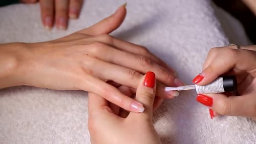 Applying Clear Nail Polish in a Nail Salon