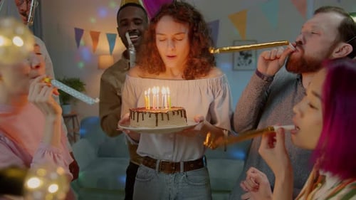 Woman Celebrates Birthday With Cheerful Friends