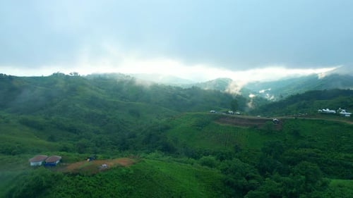 4K Aerial Drone shot flying over beautiful mountain ridge in rural jungle bush forest.