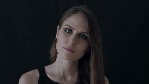 Elegant Woman with Smoky Eyes Posing