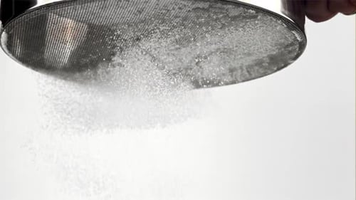 Sifting Flour Through Sieve For Baking