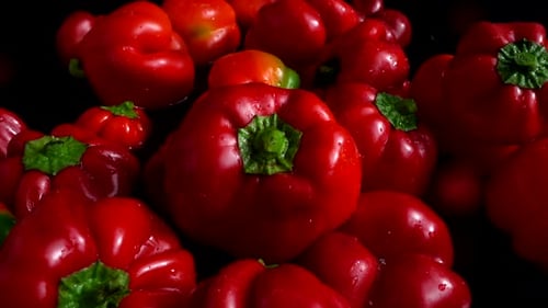 Red Bell Peppers Falling into Water
