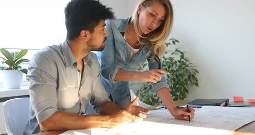 Office Coworkers in Business Meeting Discussing Project Plans