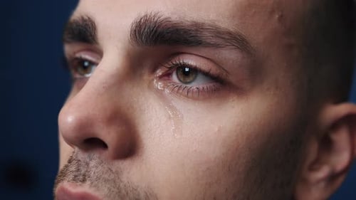Close Up Portrait Man with a Problem Crying. Cry People Concept. Tears in Eyes of Crying Man. True