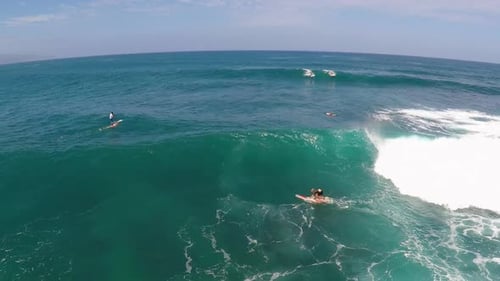 Aerial view of a wipeout while sup stand-up paddleboard surfing in Hawaii