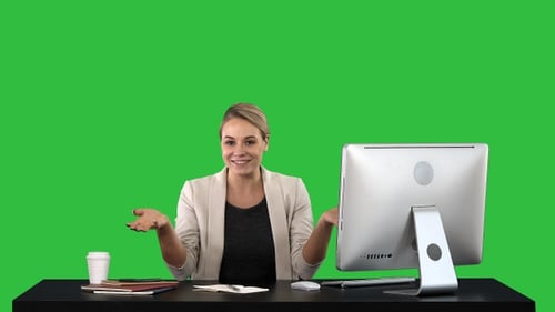 Woman at Desk Giving Presentation in Studio