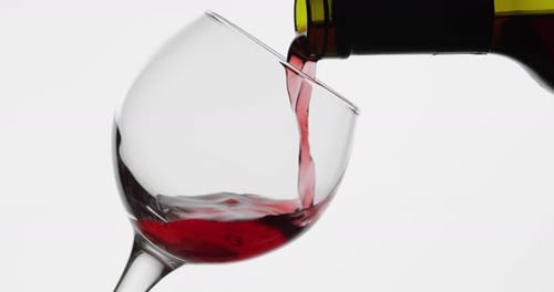 Rose Wine. Red Wine Pour in Wine Glass Over White Background