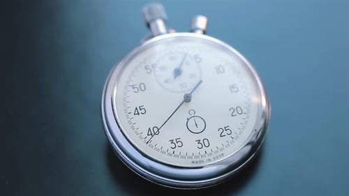 Close Up of Stopwatch Ticking on Table