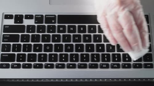 Hand Cleaning Laptop Keyboard with Wipe