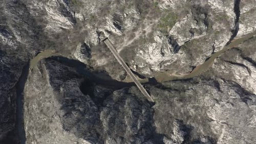 Above winding river and railroad bridge 4K drone footage