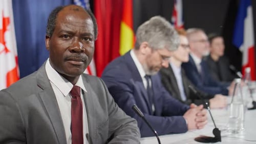 International Delegates at a Formal Press Conference