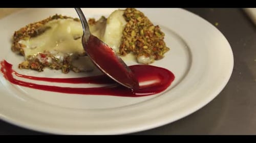 Delicious Dessert Served with Red Sauce Close Up