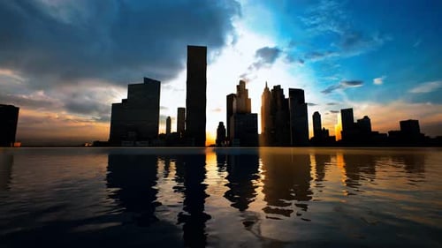 Skyline with Skyscrapers and Sea at Sunset