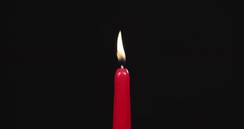 Red candle burning