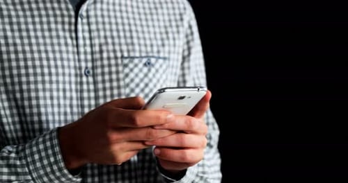 Mid section of man using mobile phone 4k