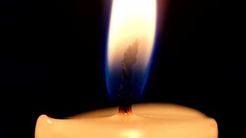 Close-up of a Candle Flame on Black Background