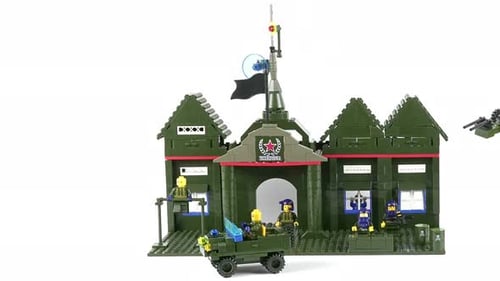 Assembled Military Model Commandant's Office And Robot Transformer On A White Background.