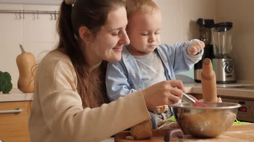 Mother and Child Baking Together in the Kitchen