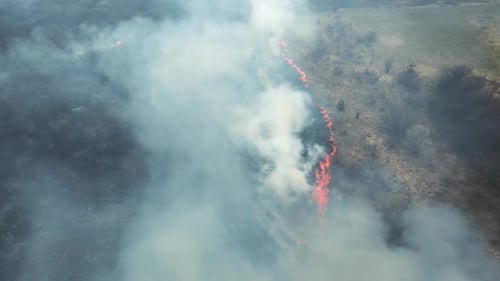 Rural Wildfire Consuming Dry Grassland from Above