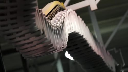 Newspapers Move Along an Assembly Line in a Factory.