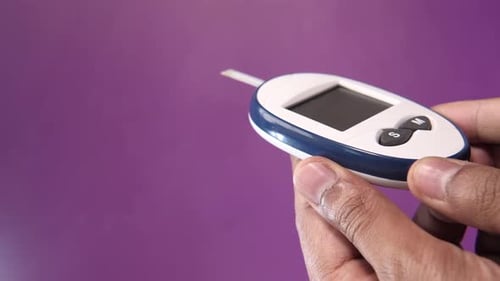 Man Hand Holding Diabetic Measurement Tools