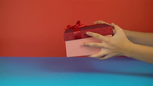 Gift Exchange and Thumbs Up on Colorful Background