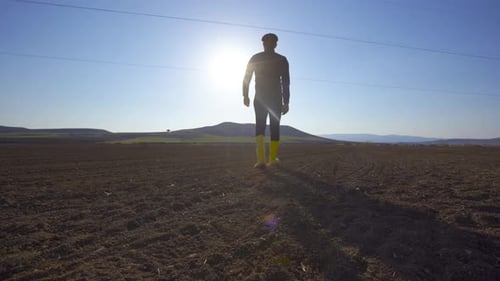 Farmer walking in the field.