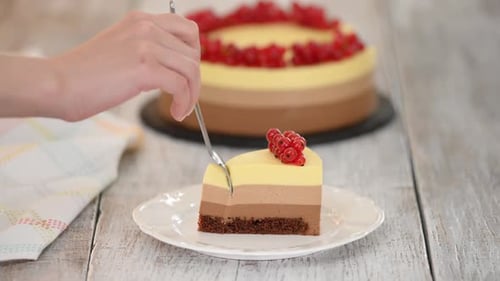 Cutting into a Three-Layer Cake Slice