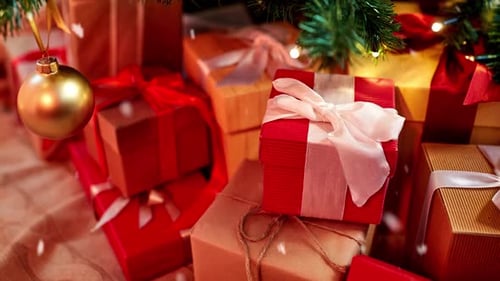 Gift Boxes Under Decorated Christmas Tree at Home