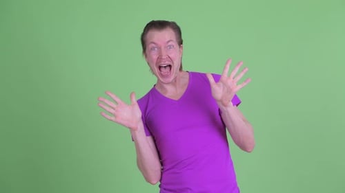 Happy Young Handsome Man with Surprise Gesture