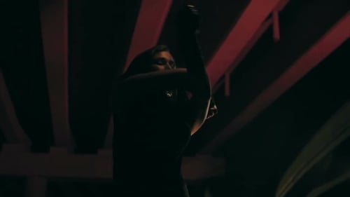 Fire Dancer Performs at Night in Urban Location