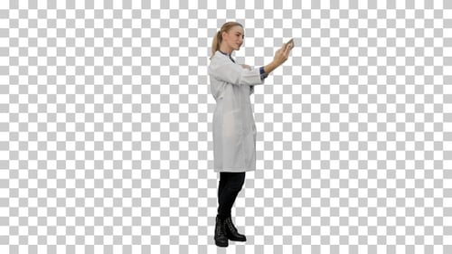 Young pretty female doctor makes selfie, Alpha Channel