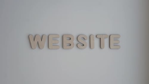 Website Spelled with Wooden Letters on White