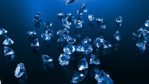 Elegant Blue Diamonds Falling and Scattering on a Reflective Surface