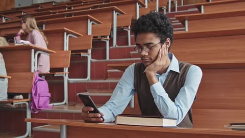 Student Using Smartphone in Classroom