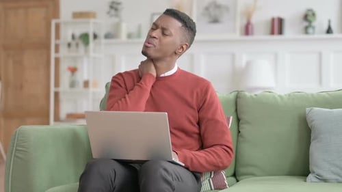 Adult Experiences Neck Pain While Using Laptop
