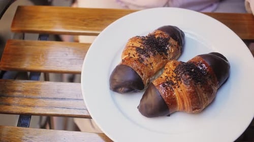 Chocolate Croissants and Coffee on Cafe Table